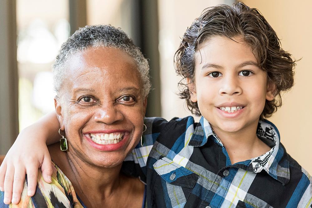 Smiling little boy posing with his grandmother